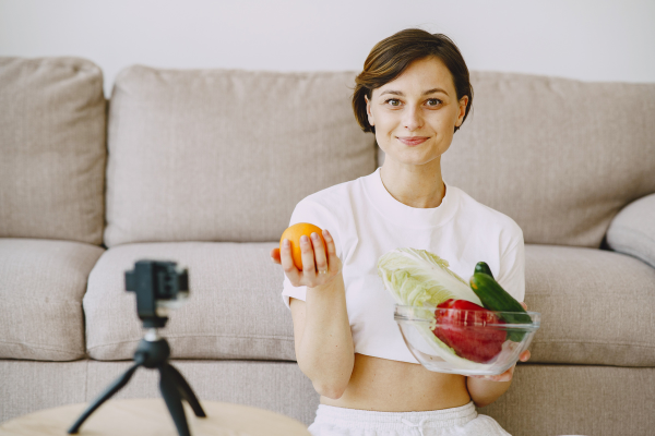 Content Creator Holding Fruits and Veggies