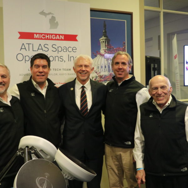 ATLAS and Bergman men standing and smiling together