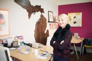 Piper & Gold owner smiling in office